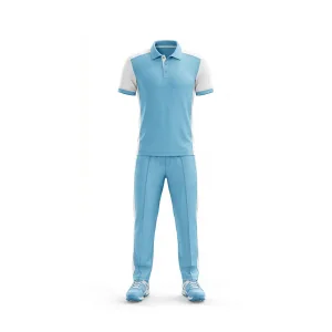 Front view of Spenix Sports Wear sky blue cricket uniform with white shoulder and side panels, including matching pants and athletic shoes.
