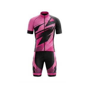Front view of a men's pink and black geometric cycling kit, including jersey and padded shorts, on a white background.